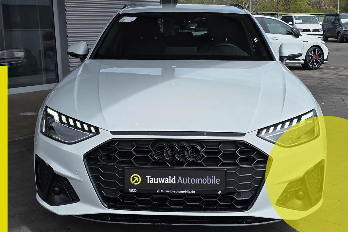 Zu sehen ist ein weißer Audi von Vorne